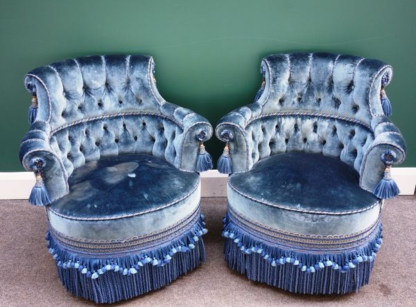 A pair of Victorian button tub back easy armchairs on turned mahogany supports. (2)