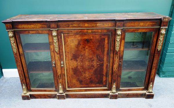 A Victorian gilt metal mounted figured walnut marquetry inlaid side cabinet, with central panel door flanked by a pair of glazed doors, 167cm wide.