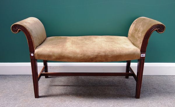 A 19th century Hepplewhite style mahogany framed window seat, with roll over arms and serpentine seat, on tapering square supports, 115cm wide.