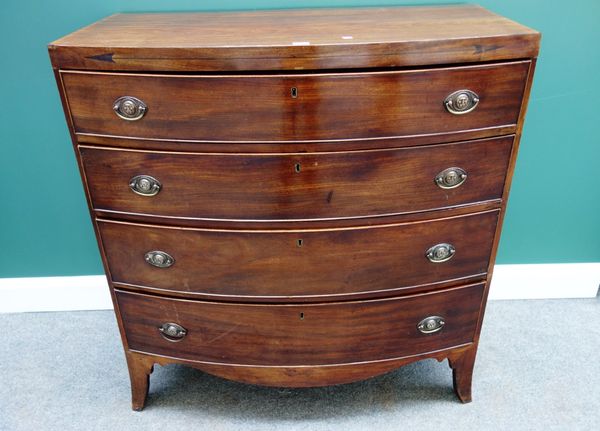 A Regency mahogany bowfront chest of four long graduated drawers, on splayed bracket feet, 59cm wide.