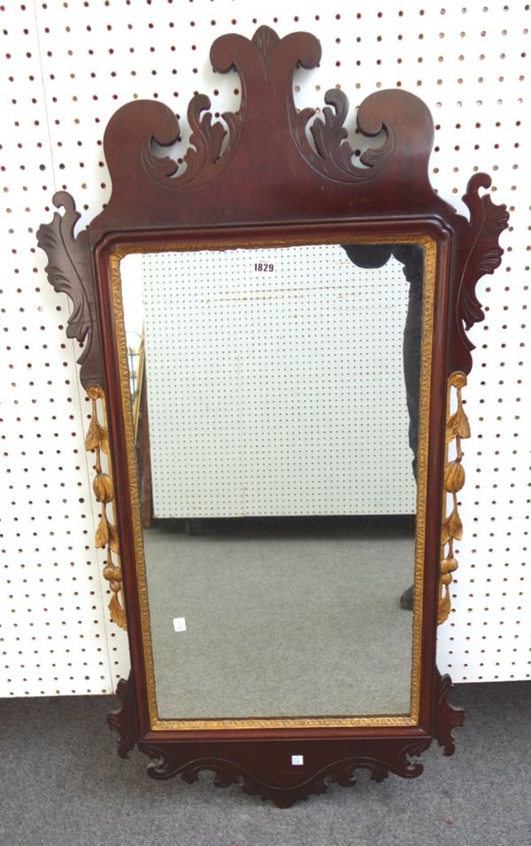 A 19th century fret carved parcel gilt mahogany pier glass, 60cm wide x 115cm high.