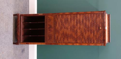 An early 20th century French inlaid and crossbanded kingwood music cabinet, with drop down tambour front over divided lower tier, on squat cabriole su