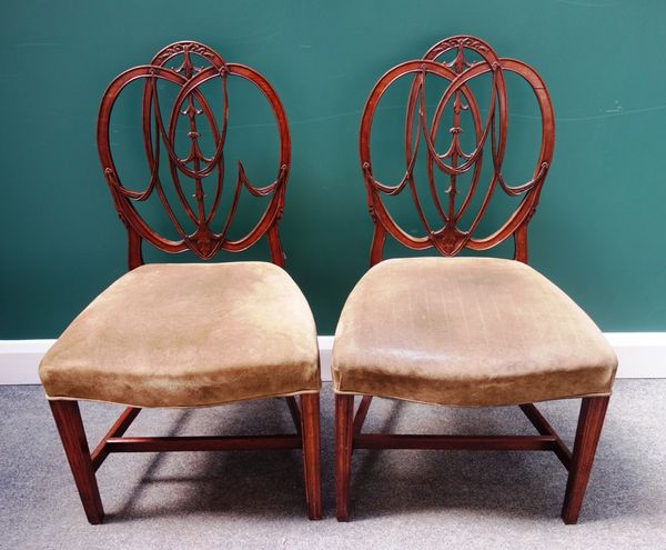 A set of six mahogany framed Hepplewhite design dining chairs, with interlaced splat and serpentine seat on tapering square supports,(6).