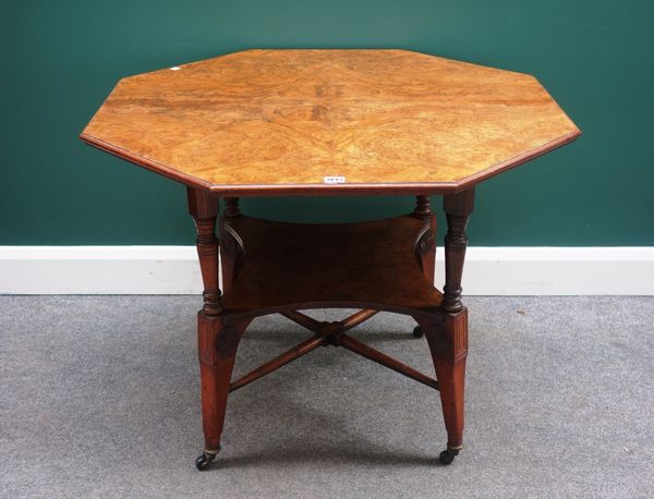 In the manner of Shoolbred a late 19th century Aesthetic movement figured walnut occasional table, the octagonal top on turned and splayed supports, u