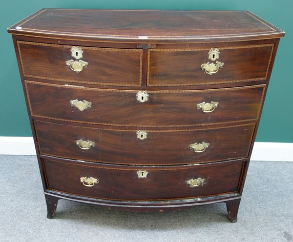 An early 19th century herringbone banded mahogany bowfront chest of two short and three long graduated drawers, on splayed bracket feet, 106cm wide.