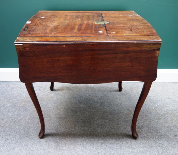 A George III mahogany butterfly drop flap reading table, with lift-up angle adjustment top and fitted frieze drawer on cabriole supports, 76cm wide.