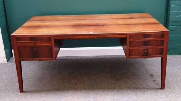 A mid 20th century teak pedestal desk, with five frieze drawers on tapering square supports, 168cm wide.