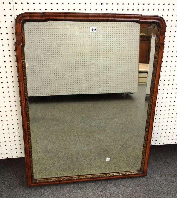 An early 18th century style parcel gilt walnut arch top wall mirror with bevelled mirror plate, 72cm wide x 94cm high, together with another similar,