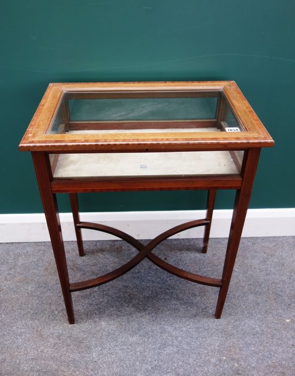 An Edwardian inlaid mahogany rectangular bijouterie table on tapering square supports, united by an 'X' frame stretcher, 57cm wide.