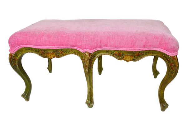 A late 18th/early 19th century North Italian polychrome painted footstool, the shaped rectangular top on six cabriole supports, 90cm wide. Illustrated