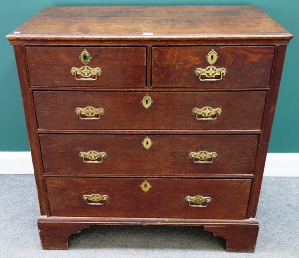 A mid 18th century oak chest of two short and three long graduated drawers on bracket feet, 95cm wide.