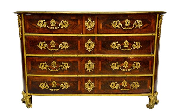 An early 18th century French ormolu mounted kingwood and rosewood parquetry inlaid bowfront commode with two short over three long drawers, on opposin