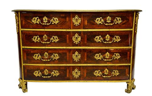 An early 18th century French ormolu mounted kingwood and rosewood parquetry inlaid bowfront commode with two short over three long drawers, on opposin