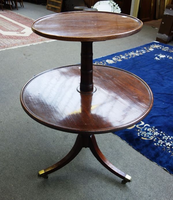 A Regency mahogany graduated circular two tier dumb waiter, on tripod base, 92cm wide.