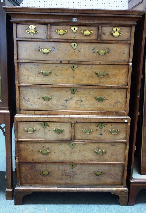 An 18th century walnut chest on chest of three short over three long graduated drawers, the base with two short over two long graduated drawers on bra