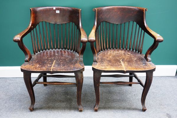 A pair of late 19th century oak framed tub back armchairs, with solid seats and cabriole supports. (2)