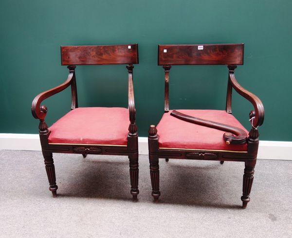 A pair of Regency mahogany framed carver chairs, with shepherds crook arms and straight front seat, on tapering reeded supports, (2).