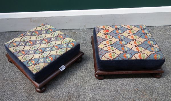 A pair of 19th century mahogany framed square footstools, on bun feet, 35cm wide, (2).