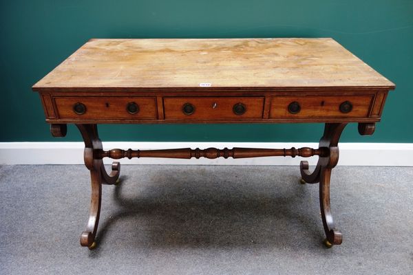 A Regency mahogany sofa table, with three frieze drawers and dummy verso, on 'X' framed trestle supports, united by turned stretcher, 107cm wide.