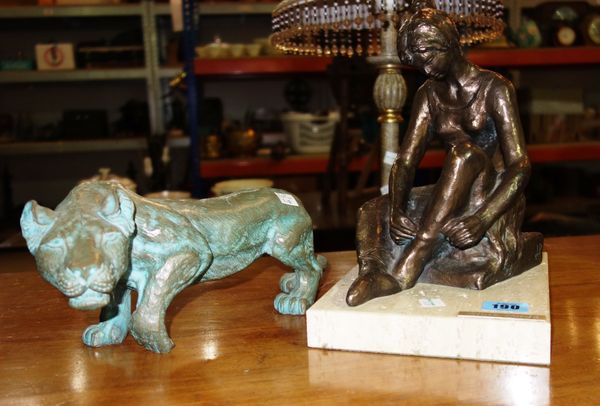 A 20th century bronze of a seated girl, signed 'Lluiz Jorda', and a 20th century bronze of a big cat. (2)