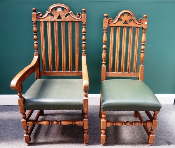 Brights of Nettlebed, a set of eight oak framed dining chairs, with carved arch crest and slatted back, on block and turned supports, to include a pai