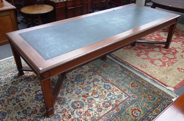 A large 18th century style mahogany library table, the leather inset rectangular top on six tapering square supports united by shaped stretcher, 122cm