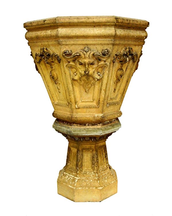 Probably Doulton Lambeth & Co, a 19th century stoneware tapering octagonal jardiniere, relief moulded with green man masks, on tapering octagonal socl