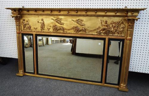 A Regency gilt framed triple plate over mantel mirror, the ball mounted frieze with lion drawn chariot scene and reeded columns, 151cm wide x 89cm hig