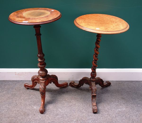 A Victorian figured walnut occasional table, the circular top on a fluted column and tripod base, 38cm wide, together with another similar, 40cm wide,