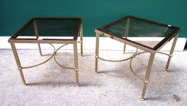 A pair of 20th century square occasional tables, each with smoked glass tops, on reeded lacquered brass supports, united by 'X' frame stretcher, 46cm