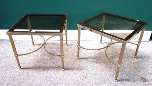 A pair of 20th century square occasional tables, each with smoked glass tops, on reeded lacquered brass supports, united by 'X' frame stretcher, 46cm