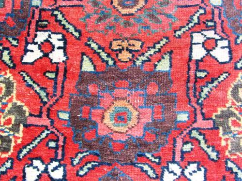 A George III tulipwood banded mahogany Pembroke table, with rounded frieze drawer and dummy verso, on tapering square supports, 74cm wide.