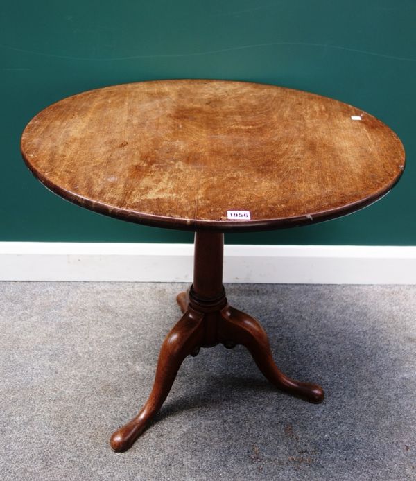 An 18th century mahogany tripod table, the one piece solid circular snap top on birdcage support and tripod base, 75cm wise.
