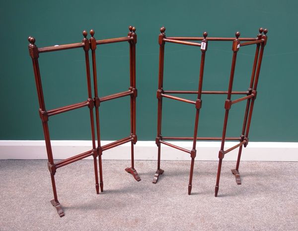 A pair of 19th century mahogany framed folding towel rails, with turned decoration, each 107cm wide, opened, (2).