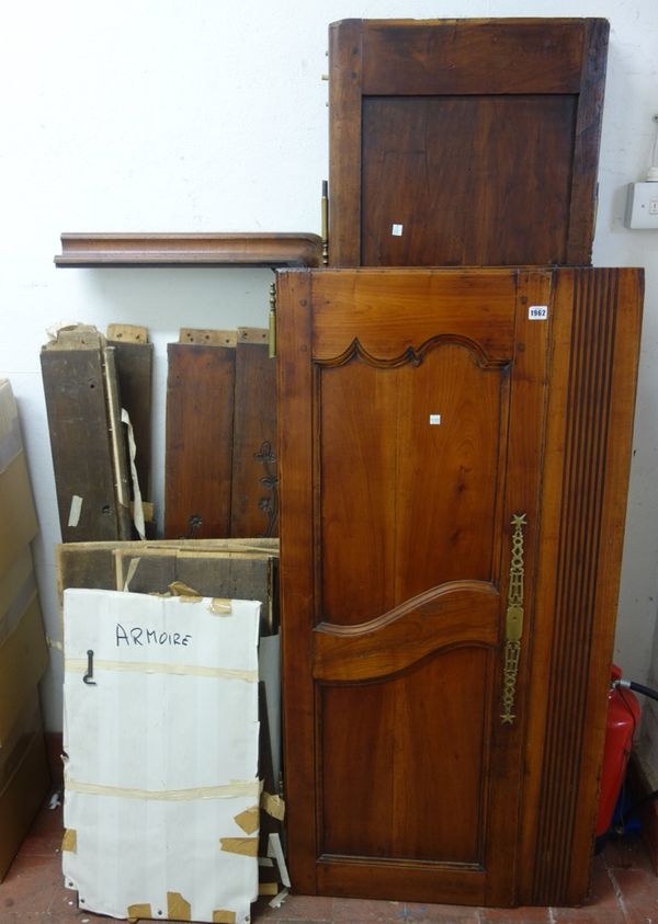 A 19th century French fruitwood two door armoire, on pointed cabriole supports, 140cm wide x 181cm high.