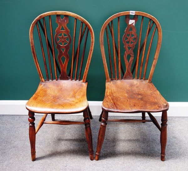 A matched set of six 19th century ash and elm wheel back dining chairs, on turned supports, (6).