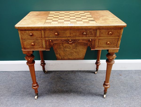 A Victorian figured walnut work/games table, the chessboard inlaid rectangular top over an arrangement of five frieze drawers and pull out wool box, o