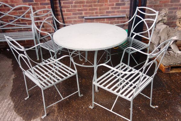A Regency design grey painted circular garden table, 106cm wide, together with four matching armchairs, (5).