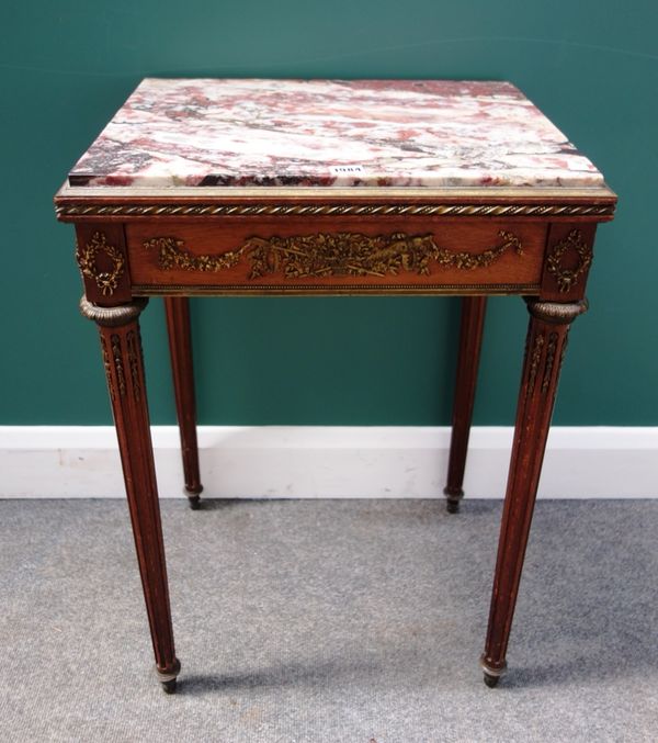 An Empire style side table, the rectangular marble top over a gilt metal mounted mahogany base, with single frieze drawer on tapering fluted supports,