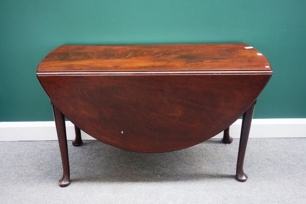 A mid 18th century mahogany drop flap dining table, on pad feet, 123cm wide.