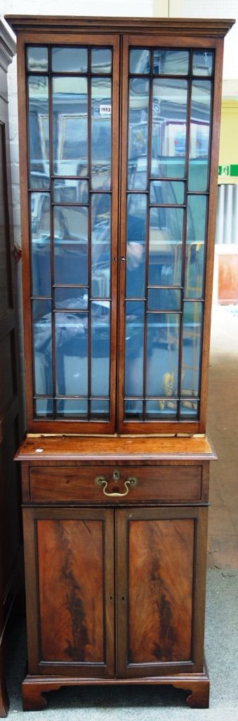 A made-up 19th century bookcase cabinet, the pair of astragal glazed doors over a single drawer and pair of cupboards, on bracket feet, 63cm wide x 20