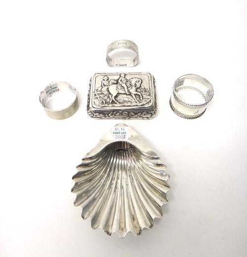 Silver, comprising; a rectangular hinge lidded box, the cover decorated with Napoleon on horseback and with foliate borders, import mark Sheffield 190