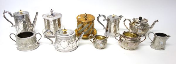 A Victorian plated five piece tea and coffee set, a plated three piece tea set, a plated cylindrical biscuit barrel, raised on three feet and another