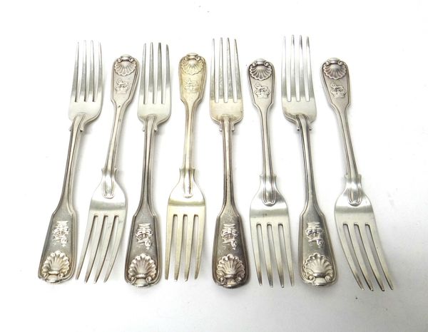 Four silver double struck, fiddle thread and shell pattern table forks, cast with lion and crown crests, London 1851 and four silver double struck, fi