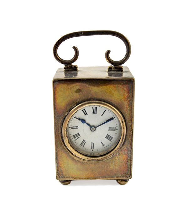 A silver rectangular cased miniature carriage clock time piece, with a keyless wind French movement, the enamelled dial with black Roman hour numerals