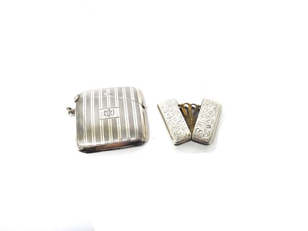 A Victorian silver rectangular folding vesta case, with a fitted fan shaped pierced interior, detailed Patent 8189 London, the exterior having scroll