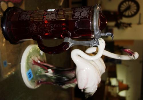A 20th century French ceramic figure of flamingos and a Bavarian ruby glass stein.