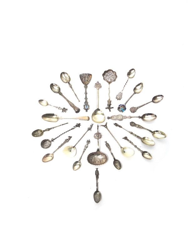 A collection of nine silver spoons, including an enameled town crest spoon and two copies of the Coronation anointing spoon, combined weight, 161gms,