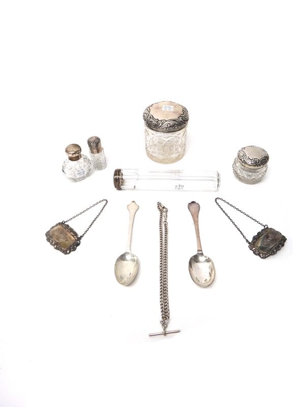 Silver and silver mounted wares, comprising; two faceted glass jars, a glass toothbrush jar, a smelling salts bottle, a scent bottle, two decanter lab