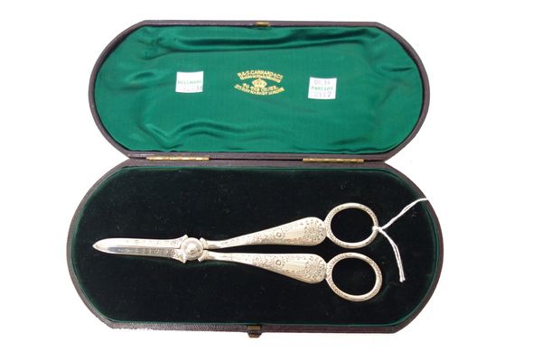 A pair of silver grape scissors, with floral and foliate engraved decoration, Sheffield 1902, weight 102gms, with a case.